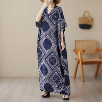 Ethnic Bohemian beach dress for women, casual and fashionable, featuring vibrant patterns and flowing fabric by MANDOTOS INTERNATIONAL.