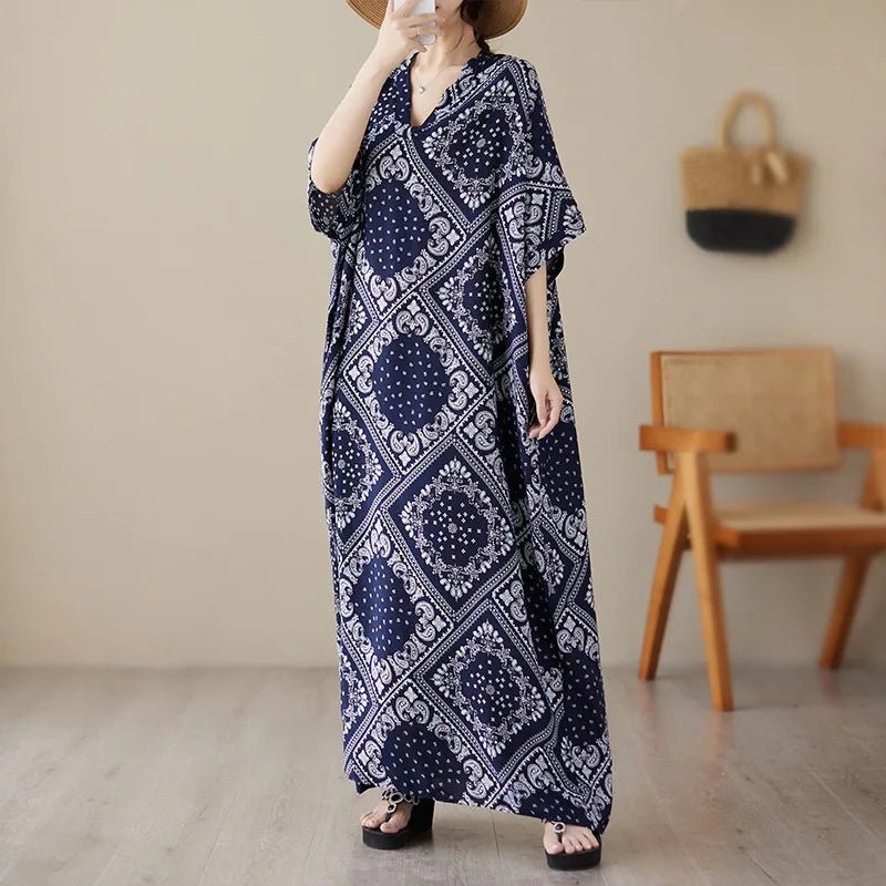 Ethnic Bohemian beach dress for women, casual and fashionable, featuring vibrant patterns and flowing fabric by MANDOTOS INTERNATIONAL.