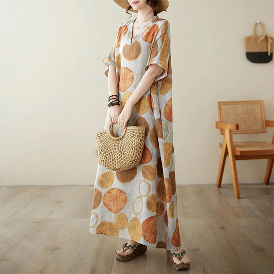 Ethnic Bohemian beach dress for women by MANDOTOS INTERNATIONAL, casual fashion with vibrant patterns and flowing fabric.
