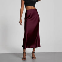 European American style satin midi skirt by MANDOTOS INTERNATIONAL, featuring a smooth, elegant fabric and classic midi length.