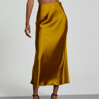 European American style satin midi skirt by MANDOTOS INTERNATIONAL, displayed on a model showcasing its elegant design.