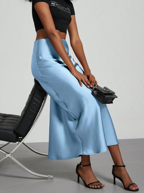 European American style satin midi skirt by MANDOTOS INTERNATIONAL, shown in a sleek, in-stock design with a smooth satin finish.