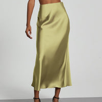 European American style satin midi skirt by MANDOTOS INTERNATIONAL, shown in a flowing, elegant design with a smooth satin finish.