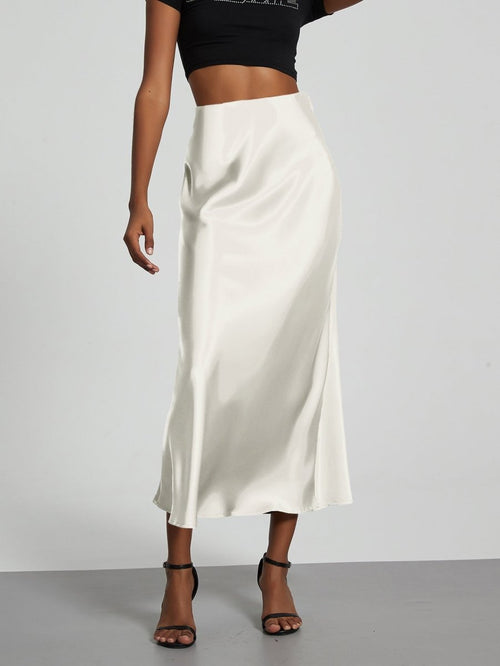 European American style satin midi skirt by MANDOTOS INTERNATIONAL, shown in a sleek, elegant design, in stock for wholesale purchase.