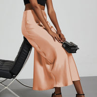 European American style satin midi skirt by MANDOTOS INTERNATIONAL, featuring a smooth fabric and elegant design.