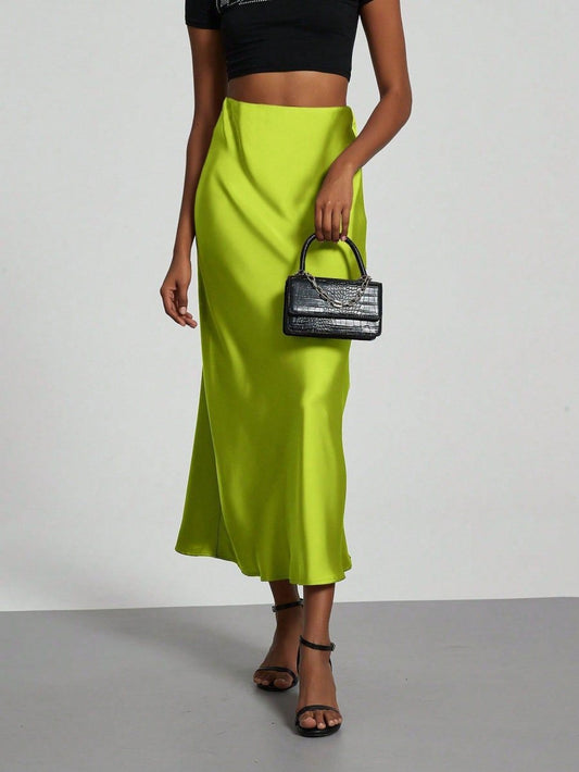 European American style satin midi skirt by MANDOTOS INTERNATIONAL, showcasing a sleek, elegant design in a smooth satin fabric.