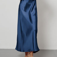 European American style satin midi skirt by MANDOTOS INTERNATIONAL, shown in a sleek, elegant design perfect for fashion-forward looks.
