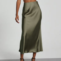 European American style satin midi skirt by Mandotos International, shown in soft, shiny fabric with a high waist and elegant silhouette.