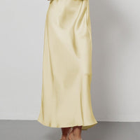 European American style satin midi skirt by MANDOTOS INTERNATIONAL, shown in a sleek, flowing design perfect for elegant fashion.