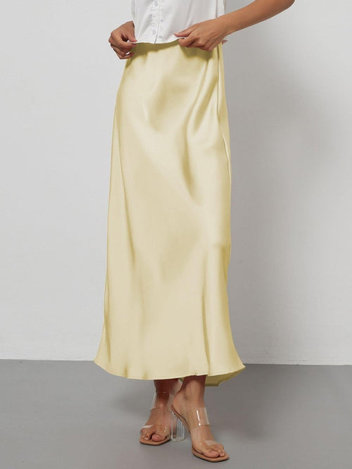 European American style satin midi skirt by MANDOTOS INTERNATIONAL, shown in a sleek, flowing design perfect for elegant fashion.