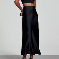 European American style satin midi skirt by MANDOTOS INTERNATIONAL, featuring a smooth fabric and elegant midi length.