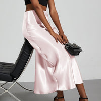 European American style satin midi skirt by Mandotos International, showcased in a retail display with smooth, shiny fabric.