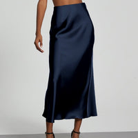 European American style satin midi skirt by MANDOTOS INTERNATIONAL, shown in a flattering silhouette with smooth fabric detail.