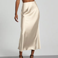 European American style satin midi skirt by MANDOTOS INTERNATIONAL, elegant and smooth fabric, in stock for wholesale purchase.