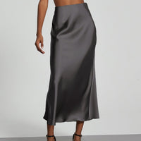 European American style satin midi skirt by MANDOTOS INTERNATIONAL, showcasing a sleek, elegant design in a natural pose.