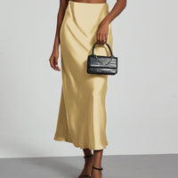European American style satin midi skirt by Mandotos International, showcasing smooth fabric and classic silhouette.