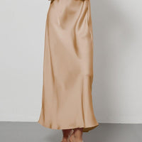 European American style satin midi skirt by Mandotos International, featuring a smooth, elegant design and in-stock for wholesale.