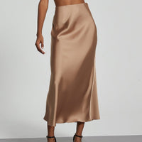 European American style satin midi skirt by MANDOTOS INTERNATIONAL, displayed in a close-up view showing its smooth fabric and elegant design.