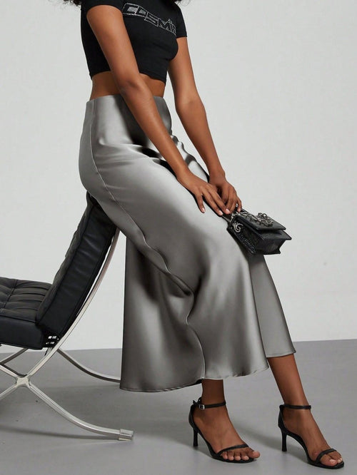 European American style satin midi skirt by MANDOTOS INTERNATIONAL, shown in a sleek, elegant design perfect for fashion-forward looks.