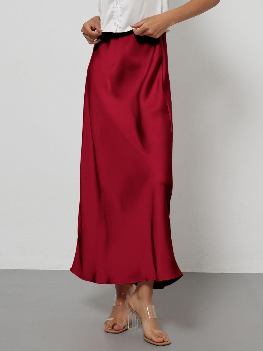 European American style satin midi skirt by MANDOTOS INTERNATIONAL, shown in a stylish, flowing design on a model.