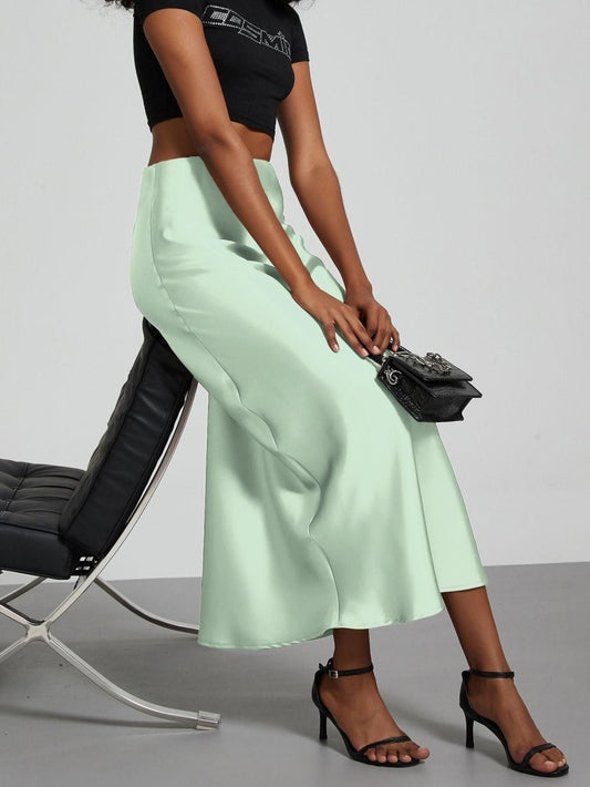 European American style satin midi skirt by MANDOTOS INTERNATIONAL, featuring smooth fabric and elegant design, in stock for wholesale.