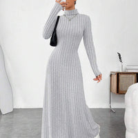 Mandotos International European and American cross-border autumn and winter women's dress with a slim fit, high collar, and long sleeves.