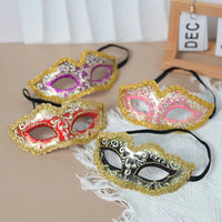 Exquisite handcrafted party mask with vibrant feathers and intricate designs for carnival and social events by MANDOTOS INTERNATIONAL.