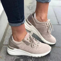 Fashionable lace-up sneakers with zipper detail and medium heel height by MANDOTOS INTERNATIONAL.