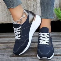 Mandotos International stylish lace-up sneakers with zipper detail and medium heel height, perfect for casual and trendy outfits.