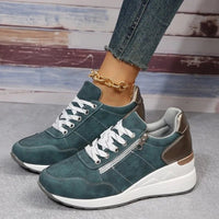 Fashionable lace-up sneakers with zipper detail and medium heel height by MANDOTOS INTERNATIONAL, displayed on a clean background.