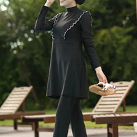 Floral burkini swimsuit for women by MANDOTOS INTERNATIONAL, modest swimwear with colorful floral pattern for middle-aged women.
