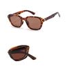 Foldable retro oval sunglasses with black TR90 frame, UV400 polarized lenses, unisex stylish design by MANDOTOS INTERNATIONAL.