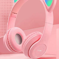 Mandotos International glow light cat ear Bluetooth headphones for kids and adults with illuminated cat ears and comfortable headband.