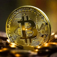 Gold plated Bitcoin coin collectible from MANDOTOS INTERNATIONAL, featuring antique-style design and physical Casascius Bitcoin art.