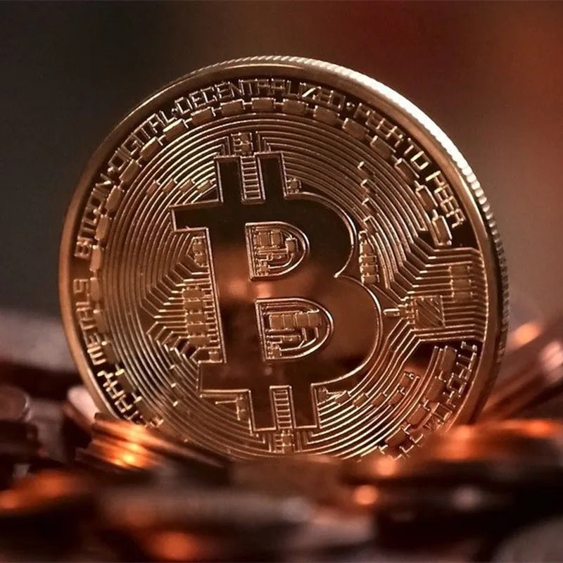 Gold plated Bitcoin coin collectible from MANDOTOS INTERNATIONAL, featuring physical Casascius Bit BTC design and antique metal finish.