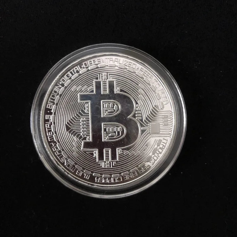 Gold-plated Bitcoin coin from MANDOTOS INTERNATIONAL, collectible art piece resembling a physical Casascius Bit BTC coin.