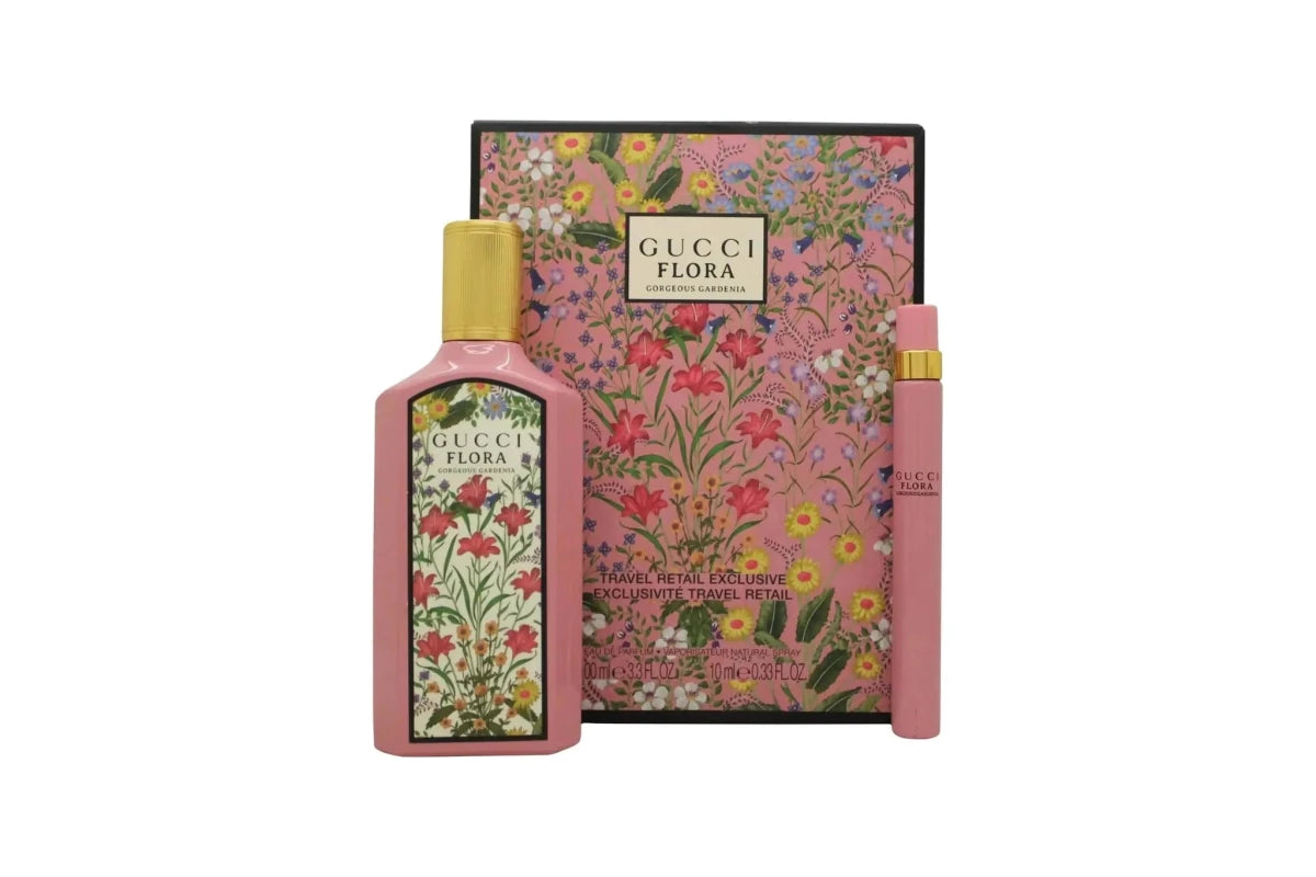 Gucci Flora Gardenia Duo EDP set with two floral perfume bottles, elegant packaging, and botanical design.