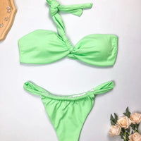 Mandotos International eco-friendly women's one-shoulder bikini set with split design, made from recycled fabric, suitable for stylish swimwear.