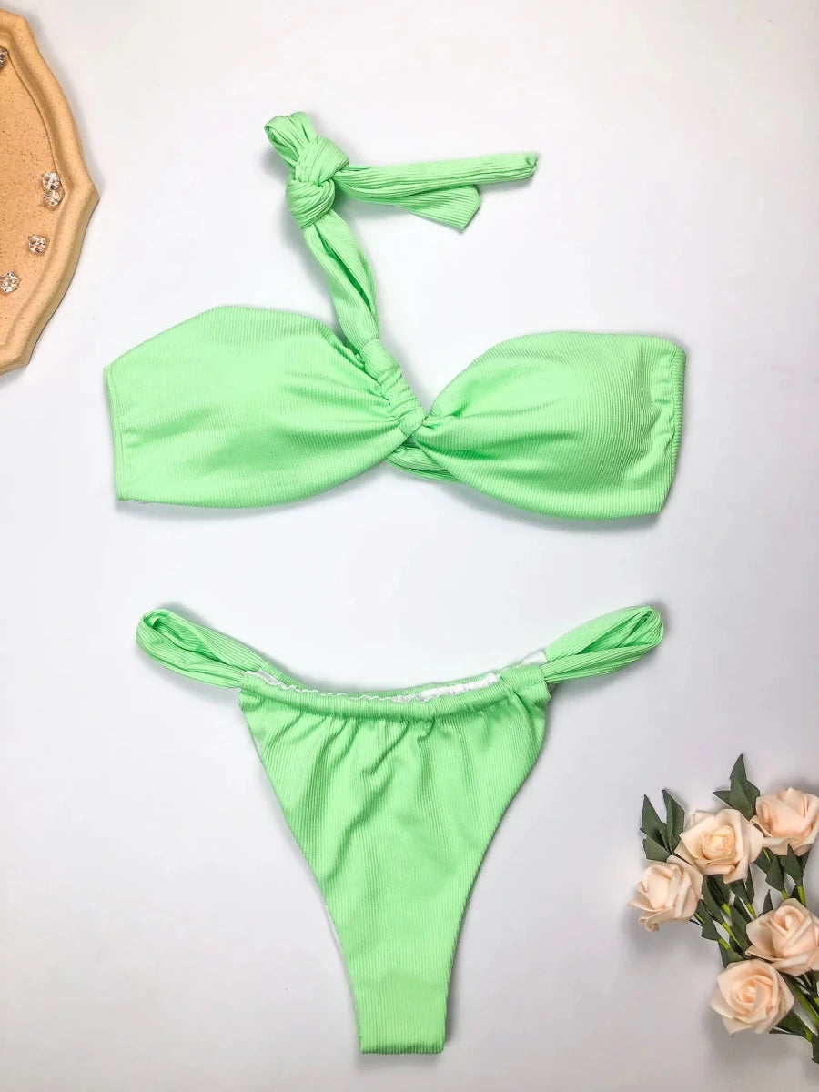 Mandotos International eco-friendly women's one-shoulder bikini set with split design, made from recycled fabric, suitable for stylish swimwear.