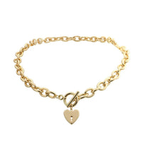 Mandotos International Heart Key Toggle Necklace featuring a silver heart-shaped key pendant on a delicate chain