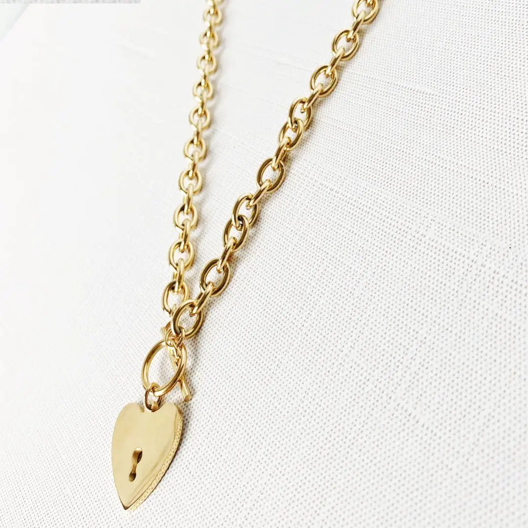 Heart-shaped key toggle necklace from MANDOTOS INTERNATIONAL with a delicate chain and detailed heart key pendant.