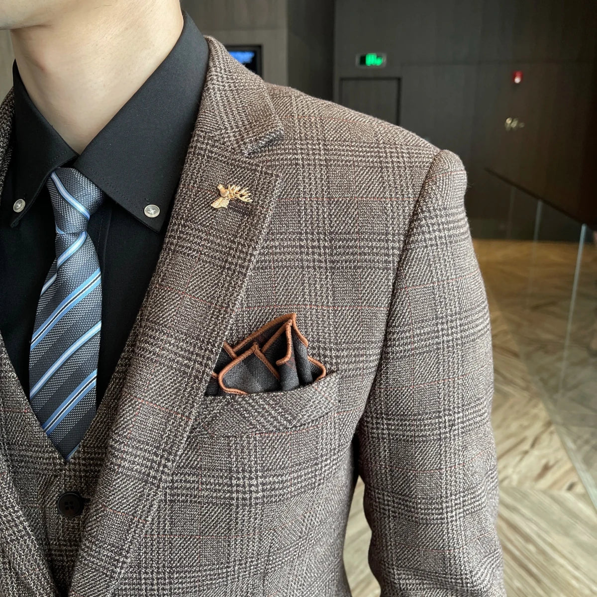 British Korean style plaid men's 3-piece business casual suit set by MANDOTOS INTERNATIONAL, featuring a jacket, vest, and trousers.