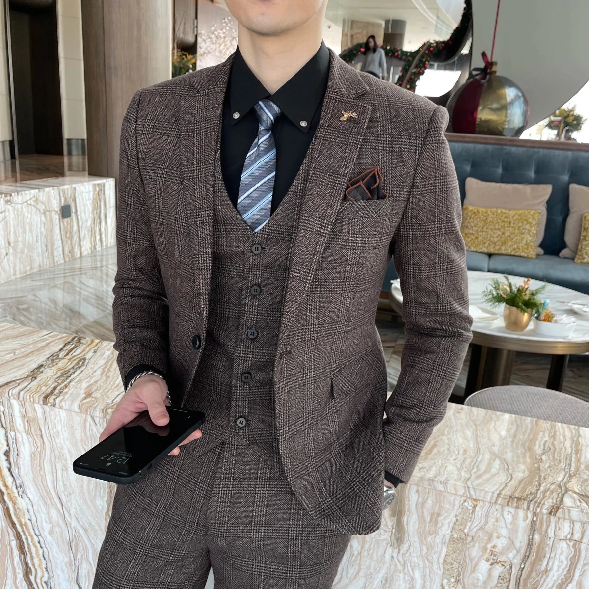 British Korean style plaid men's 3-piece business casual suit set by MANDOTOS INTERNATIONAL, featuring tailored jacket, vest, and trousers.