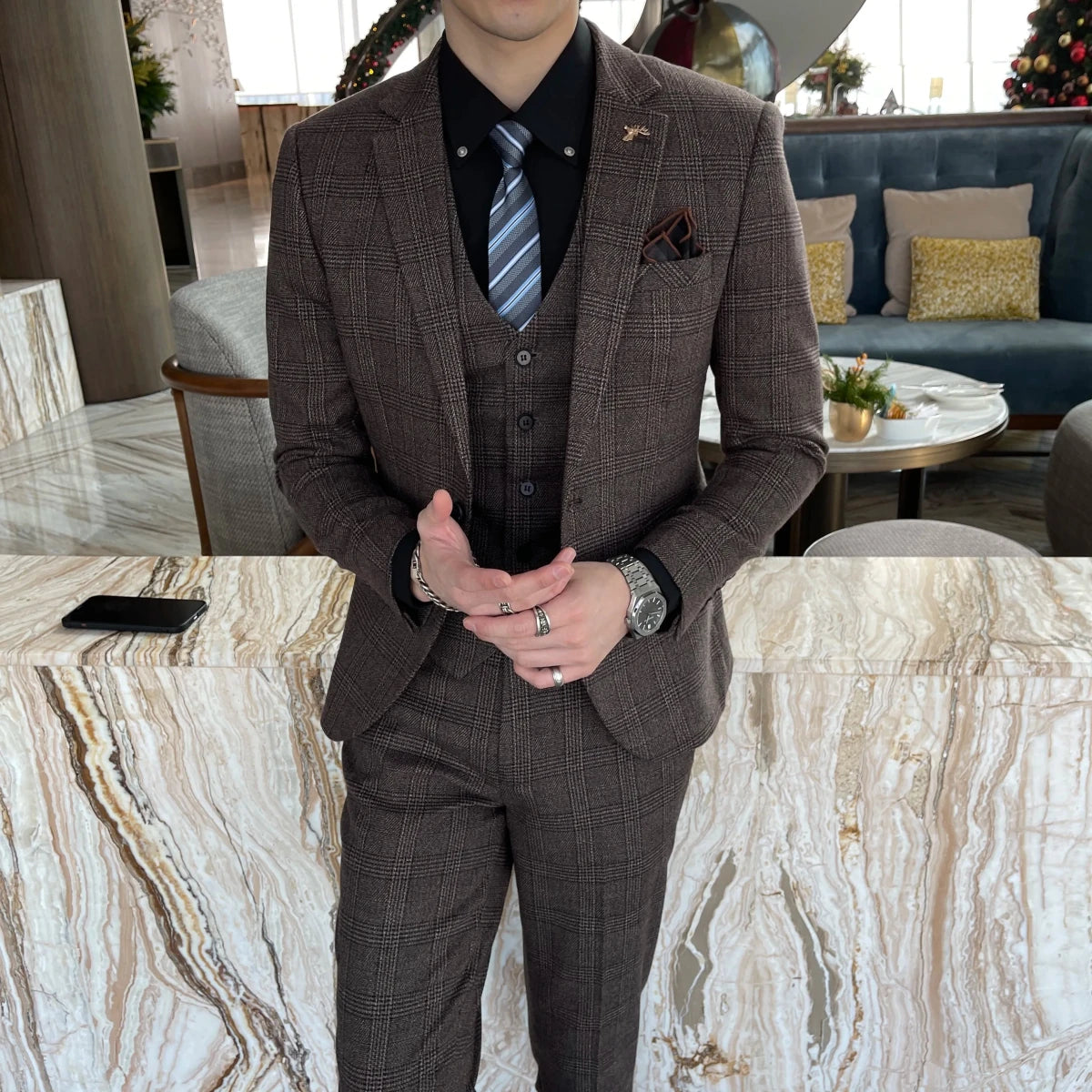 British Korean style plaid men's 3-piece business casual suit set by MANDOTOS INTERNATIONAL, featuring a blazer, vest, and trousers.