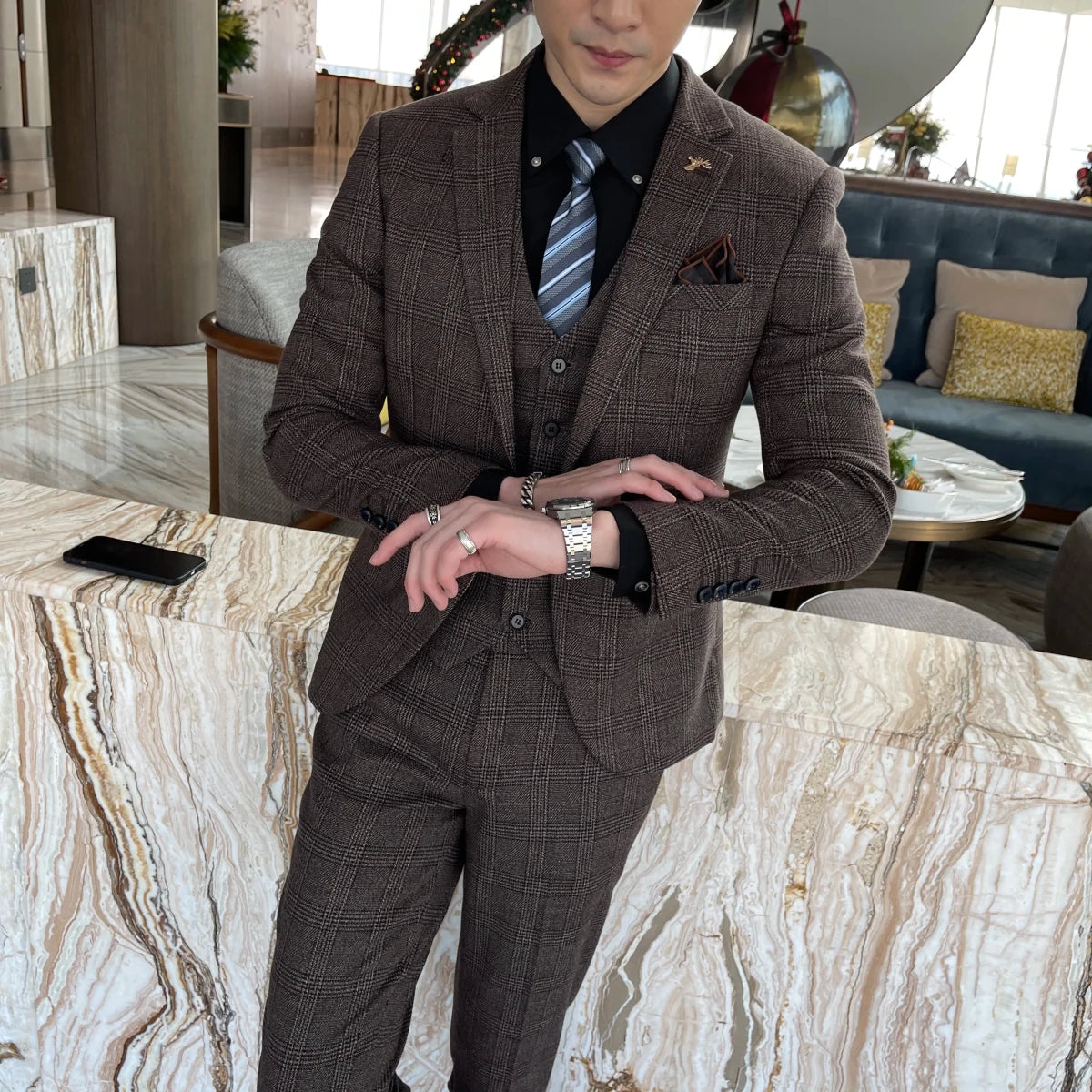 British Korean style plaid men's 3-piece business casual suit set by MANDOTOS INTERNATIONAL, featuring a jacket, vest, and trousers.