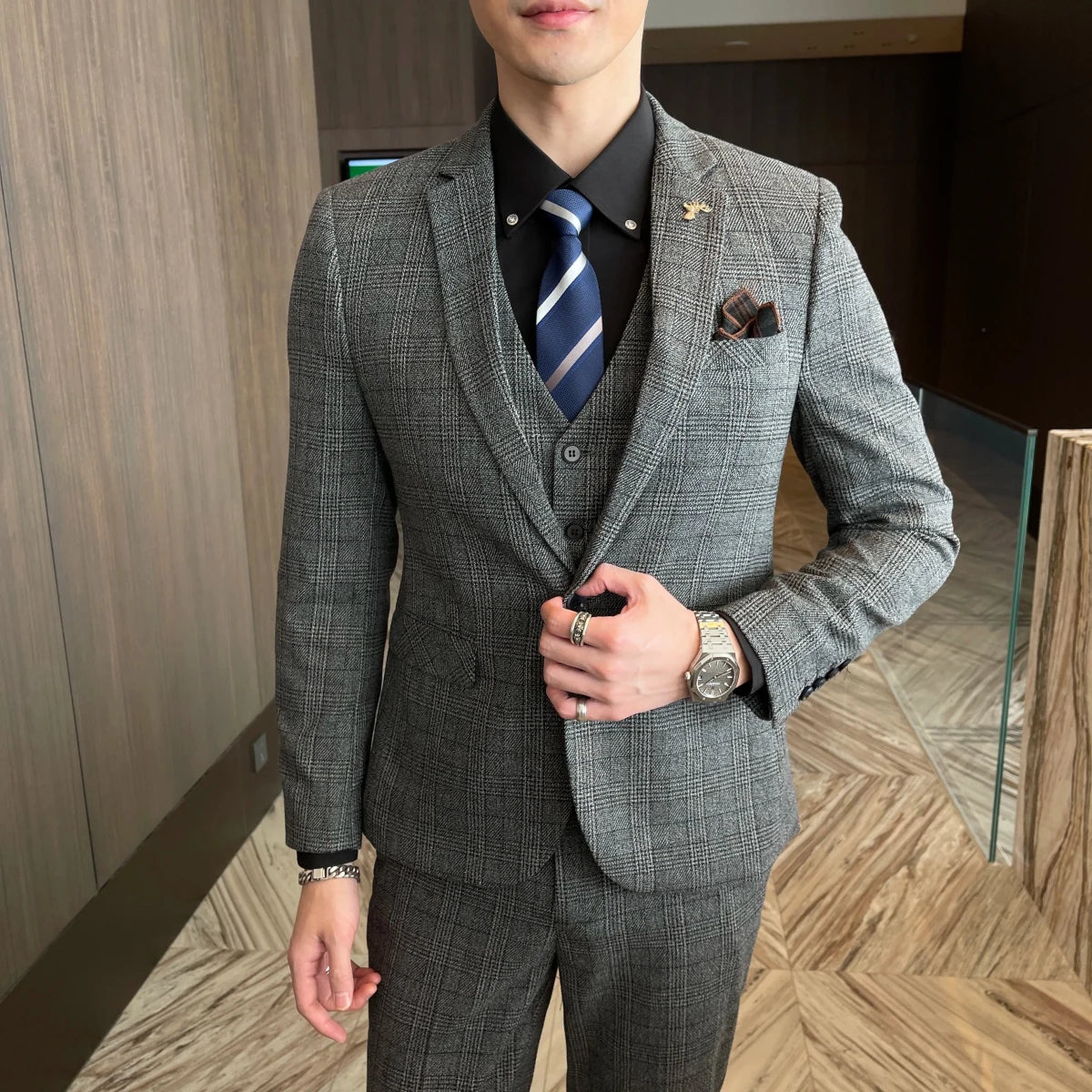 British Korean style plaid men's 3-piece business casual suit set by MANDOTOS INTERNATIONAL, featuring tailored jacket, vest, and trousers.