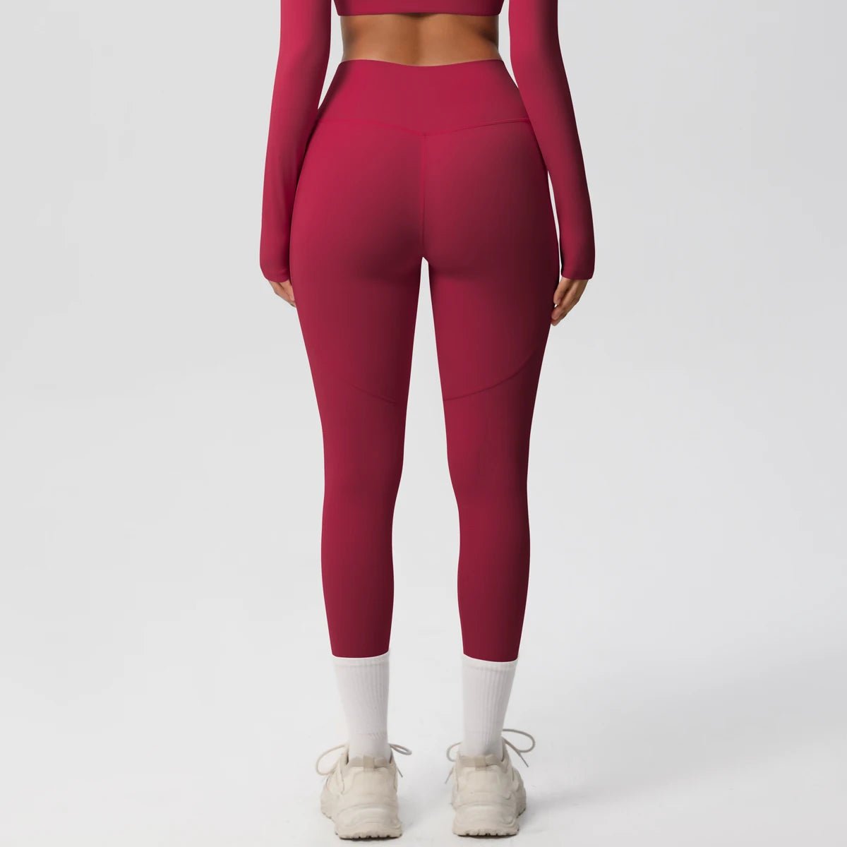 High waist women's stretch yoga leggings with pockets, push-up fit, solid color fitness pants for running and workout activities.