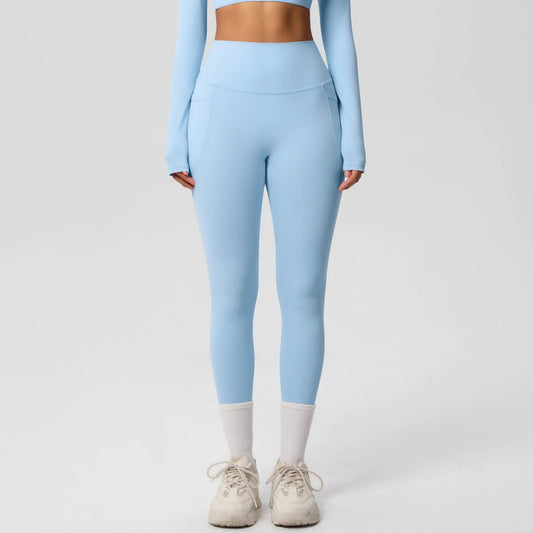 High waist women's Mandotos International yoga leggings with pockets, stretchy fabric, push-up fit, ideal for running and fitness.