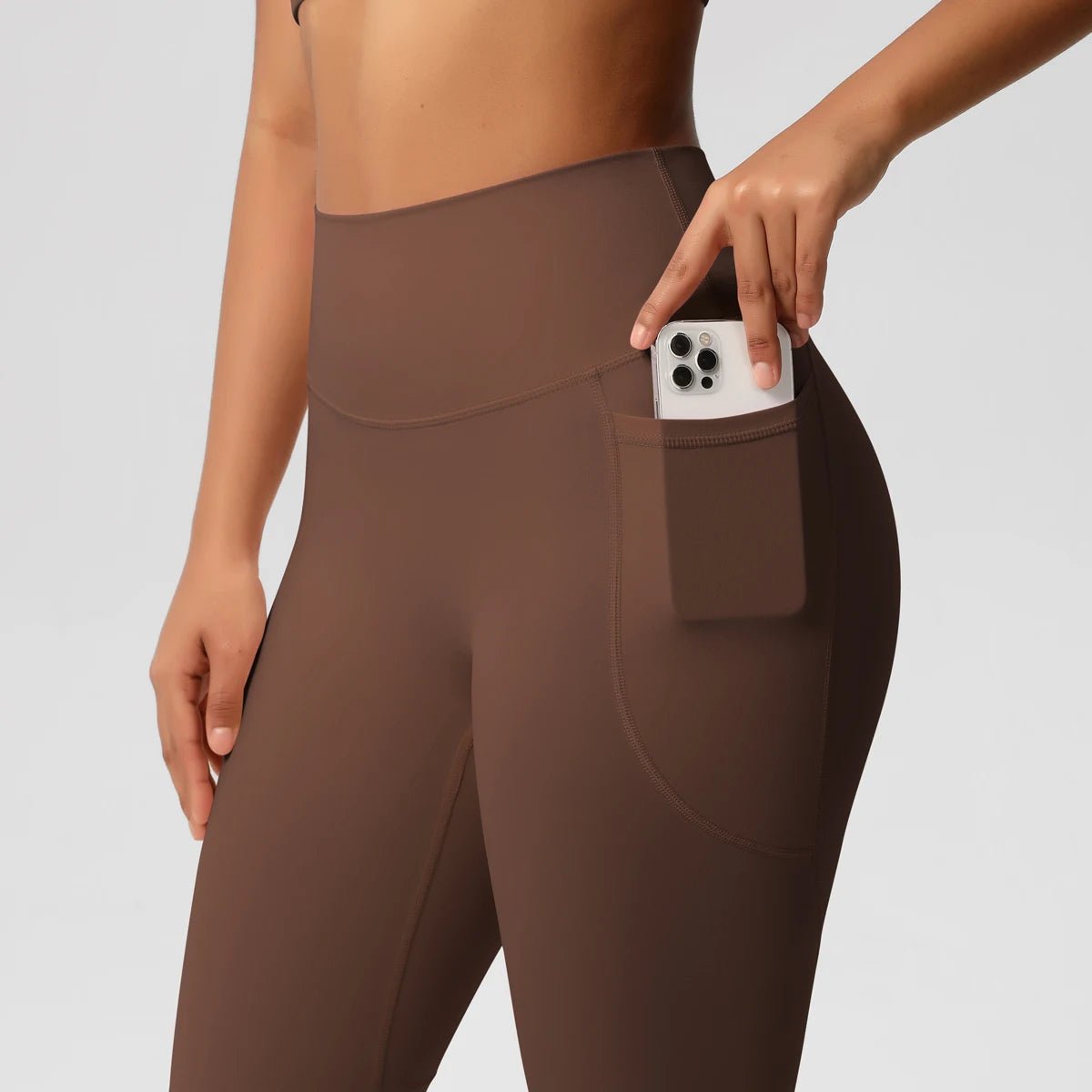 Mandotos International high waist women's yoga leggings with pockets, stretchy fitness tights suitable for running and sports.