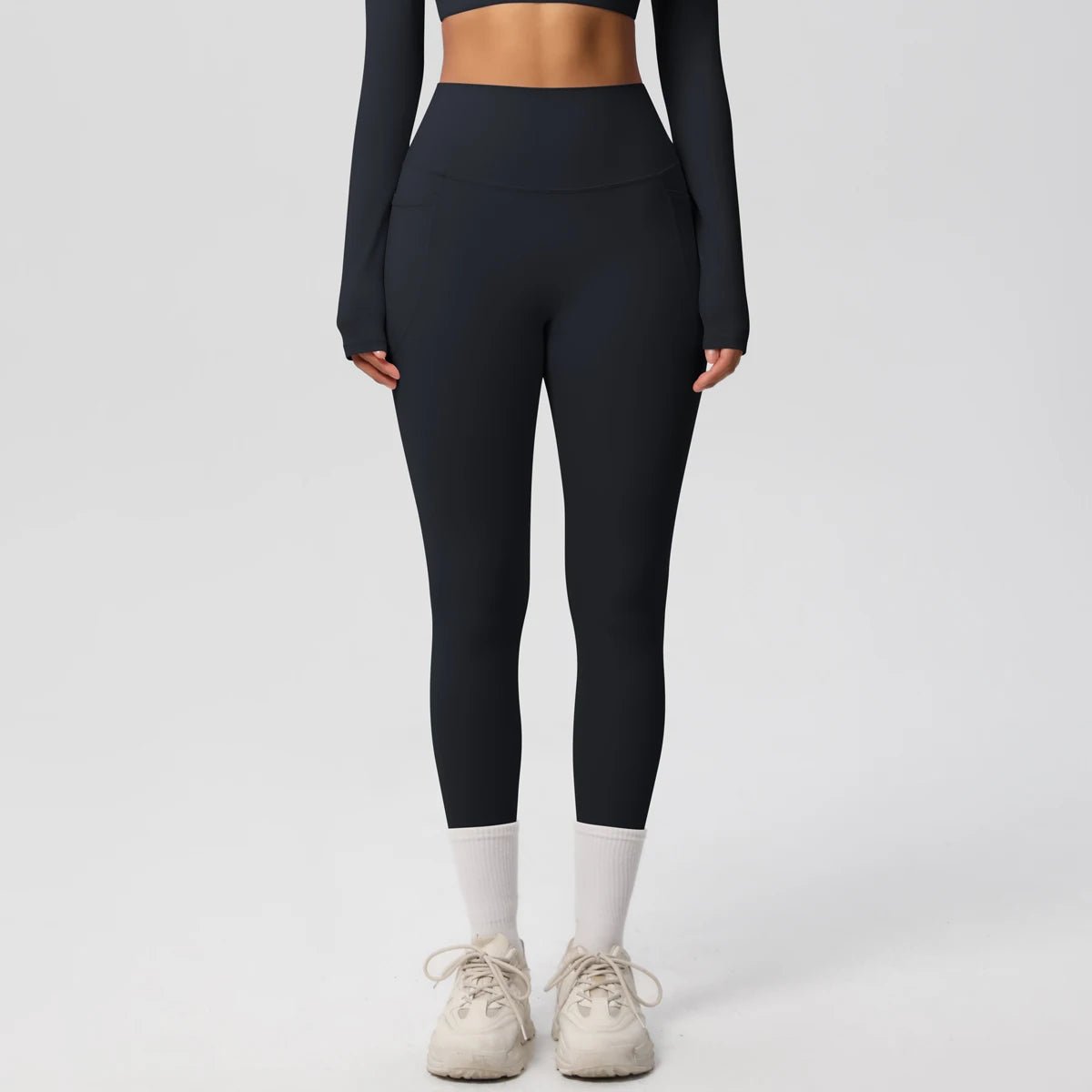High waist women's Mandotos International yoga leggings with stretch fabric, pockets, and push-up design for fitness and running activities.